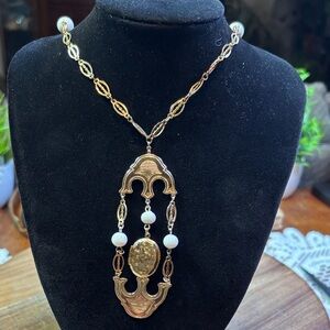 20" gold tone necklace with a locket